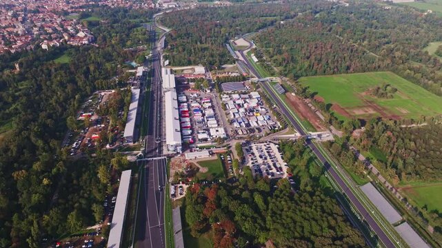 Aerial drone view of Autodromo Nazionale Monza in Monza, Italy, showcasing the iconic Formula 1 racing circuit, racetrack, grandstands, and surrounding parkland.
