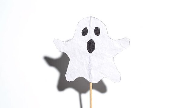 Stick puppet of spooky ghost paper design isolated in white background footage loop