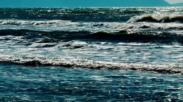Sparkling Deep Blue Sea Water With Choppy Waves And Whitecaps Under Bright Sunlight