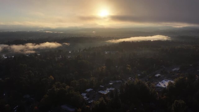 Sunrise illuminates low clouds drifting through the Willamette Valley, just south of Portland, Oregon. This scenic Pacific Northwest region is less than an hour drive from Mt. Hood.