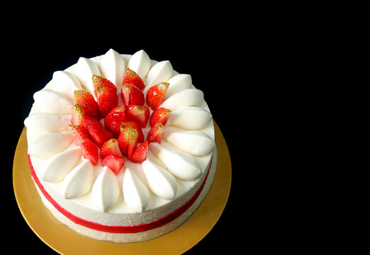 Mouthwatering Strawberry Vanilla Short Cake on Black Background with Copy Space