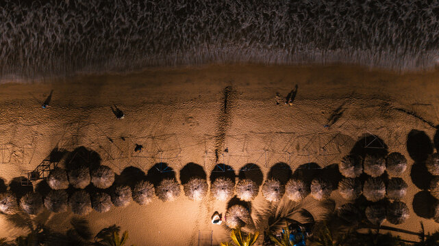 Aerial View of Tropical Beach with Thatched Umbrellas