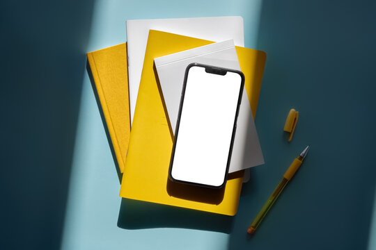 Smartphone Mockup With Blank Screen On Yellow Notebook And Stationery