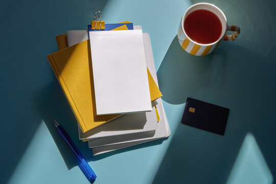 Office Still Life With Notebooks, Credit Card, Tea And Stationery
