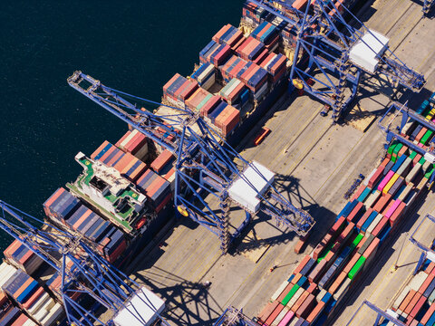 Cargo ship loading containers in port.