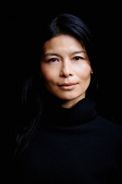 Portrait of a Woman With Black Hair and a Turtleneck Sweater