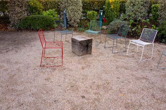 Colourful chairs in an outdoor seating area.