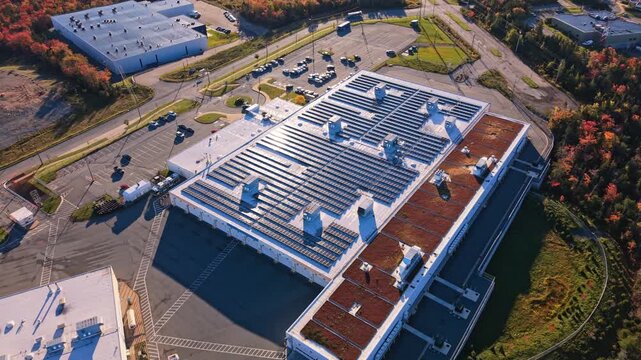 Aerial autumn view of rooftop solar panels on a commercial building in nova scotia, canada