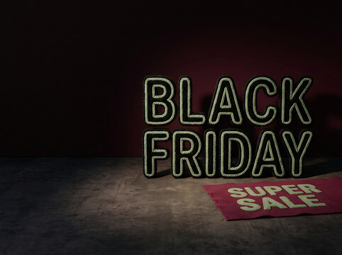 Black friday super sale text with ropelike letters and red mat on dark background for retail promotions