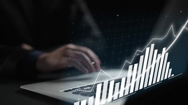 A business person focuses on a digital financial chart displayed on a laptop. This image represents analysis, strategy, and success in the fast-paced finance world. Copula