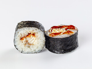 Asian sushi rolls with white rice, dark seaweed wrap, fish filling and brown glaze with sesame seeds, bistro appetizer © Andrei Starostin
