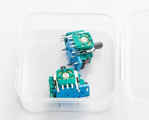Two Blue Green Analog Joystick Modules in a Clear Plastic Box © YouraPechkin