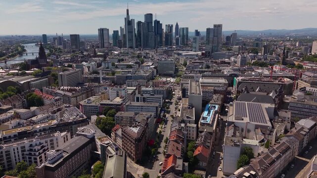 A wide aerial view above the downtown beside the city Frankfurt in Germany, Hesse on a sunny summer day