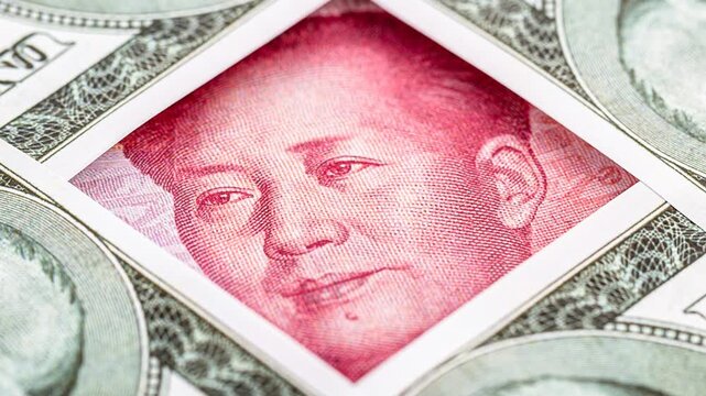 Close-up video of American one hundred dollar banknotes featuring Benjamin Franklin's portrait, with Brazilian real currency visible in the background. Symbolizing currency exchange, international tra