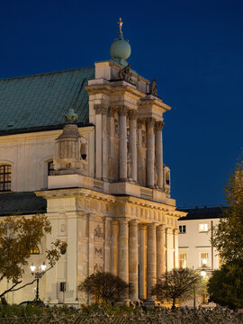 2025-10-23; Carmelite Church facade illuminated at night in Warsaw historic center. Poland