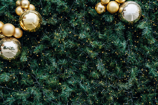 Christmas tree glowing with warm fairy lights and gold and silver ornaments