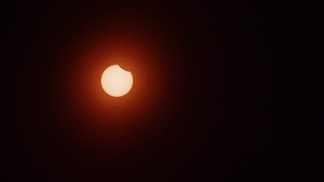 Bright sun glows against a dark sky during the 2026 solar eclipse over Nova Scotia, Canada