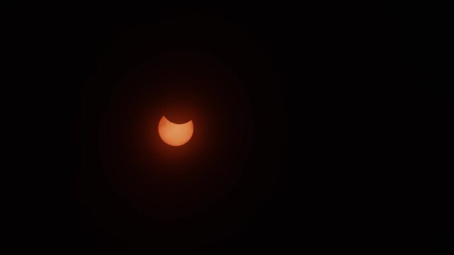The 2026 solar eclipse deepens over Nova Scotia, where the glowing sun slowly slips into shadow as the moon passes in front of it