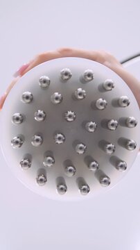 Professional body shaping therapy with vibromassage thermo vacuum and bioelectrical stimulation in beauty salon - vertical video