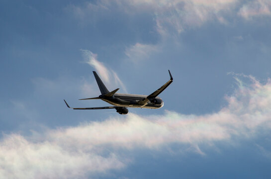 Airplane ascending into stormy sky