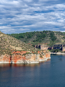 Red rock cliffs along the shore of Bighorn Lake upstream from the Yellowtail Dam at Fort Smith, Montana, USA