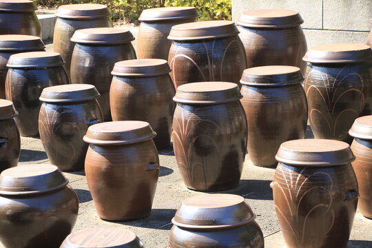 Traditional Korean Terrace with Jars Storing and Fermenting Culinary Staples like Kimchi or Soybean Paste