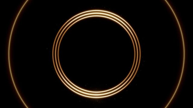 Glowing spark drawing a golden triple ring frame, then light streaks orbiting the circle on black