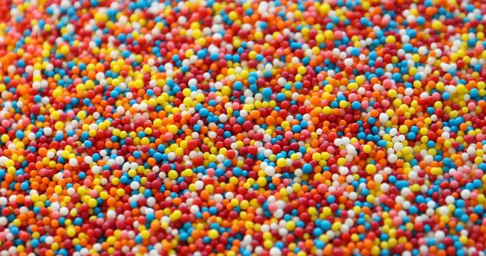 Many bright colorful sprinkles. Decoration for dessert