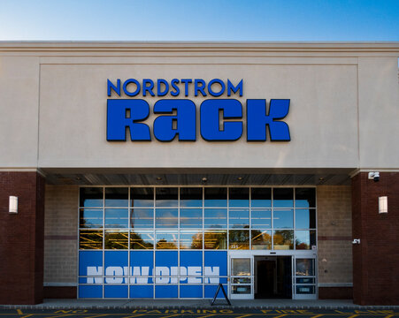 Ramsey, NJ - US - Oct 12, 2026 : The front entrance of Nordstrom Rack at Interstate Shopping Center features a blue shop sign, glass storefront windows, automatic doors, and NOW OPEN window lettering.