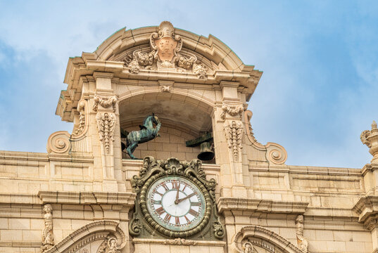 Bronx, NY - US - Oct 17, 2026 : A sculpted horse stands above the ornate clock on the Loew&rsquo;s Paradise Theatre facade, framed by elaborate carved stone columns, scrollwork and a. The scene is outdoors.