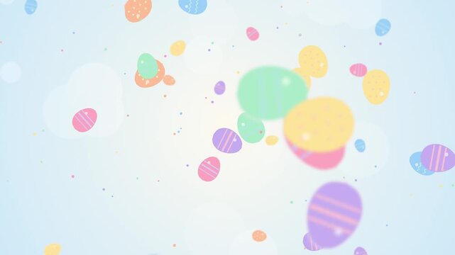 Colorful easter eggs floating and falling slowly on a soft blue background for holiday video motion.
