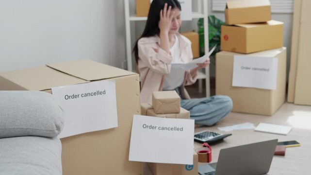 Order cancelled, Stressed and headache asian woman problem for business, customer reject, shortage, Financial problems, mortgage, loan, bankruptcy, bankrupt, poor, empty wallet, overdue