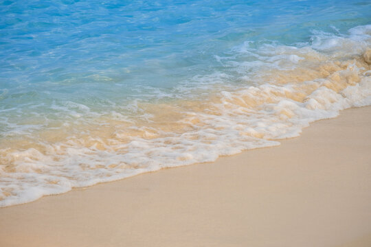 Nature of the ocean and blue sky Summer with sunshine, sandy beaches, clear blue waters sparkling against the blue sky. on an island with good ecology and environment Background for summer vacation
