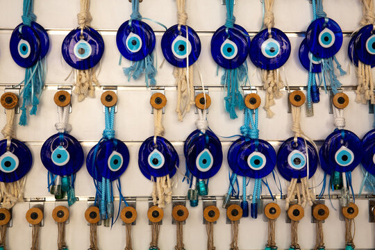 Glass Evil Eye hanging pieces - also known as Nazar Boncuğu - in Athens, Greece. They're used across many cultures to ward off negative energy, envy, and ill will
