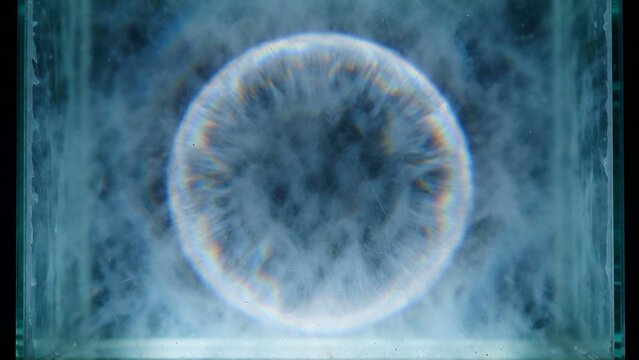 Ethereal circular light flare through misty glass