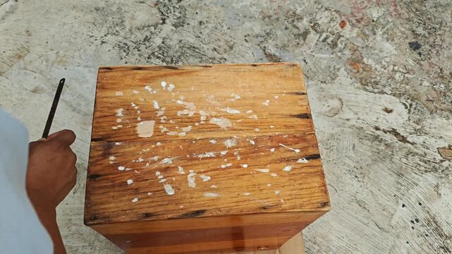 Sanding Wood with Hacksaw Blade and Wiping Dust by Hand