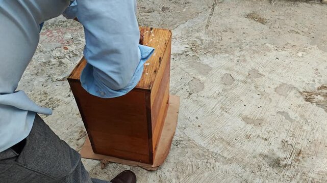 Scraping Wooden Stool Base with Hacksaw Blade
