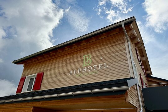 Biel, Switzerland - September 11, 2026: Alphotel Biel-Kinzig, a traditional wooden mountain hotel and restaurant in the Uri Alps, offering accommodation and dining for hikers and alpine tourists.