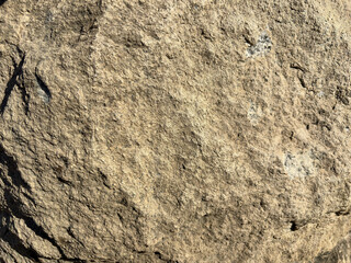 Rough Beige Rock Texture Background with Natural Stone Surface © Umi