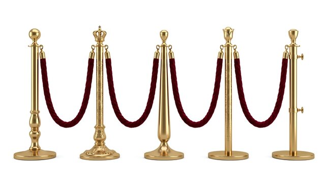 Gold velvet rope barriers with crown finials standing isolated white