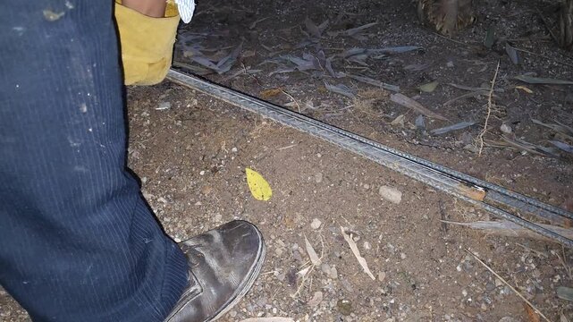 Measuring Steel Rebar Rods with Tape Measure