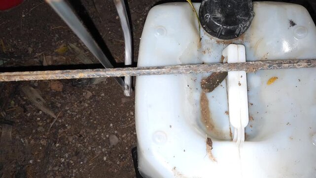 Hacksaw Blade Starting Cut on Metal Rebar Resting on Canister