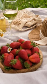 Picnic with strawberries and wine. Selective focus.