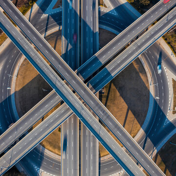 Aerial top view of complex highway interchange overpass junction with multi-lane roads