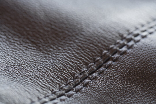 Closeup full grain gray brown leather clothes background