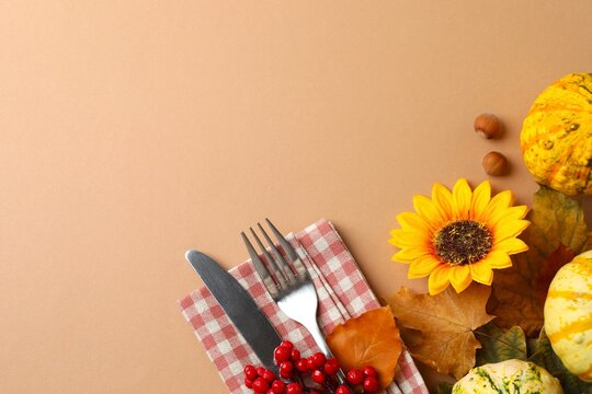 Rustic holiday table setup. Top view of plates, cutlery and autumn decorations. Thanksgiving day. Copy space