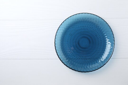 Blue empty plate on a white background