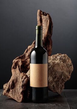 Red wine with old snag and a piece of granite rock.