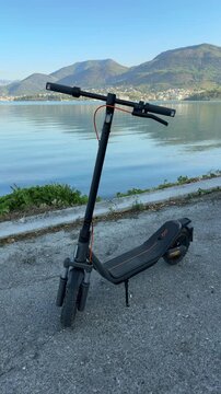 Electric Scooter Parked by the Waterfront Viewed from Above