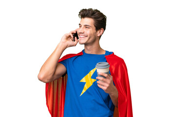 Super Hero caucasian man over isolated background holding coffee to take away and a mobile © luismolinero